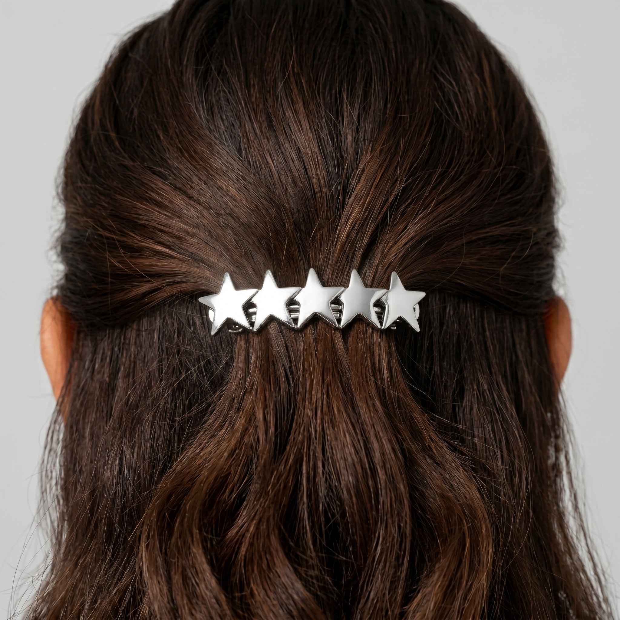 5 Star Polished Silver Hair Barrette on a person's hair against a neutral background