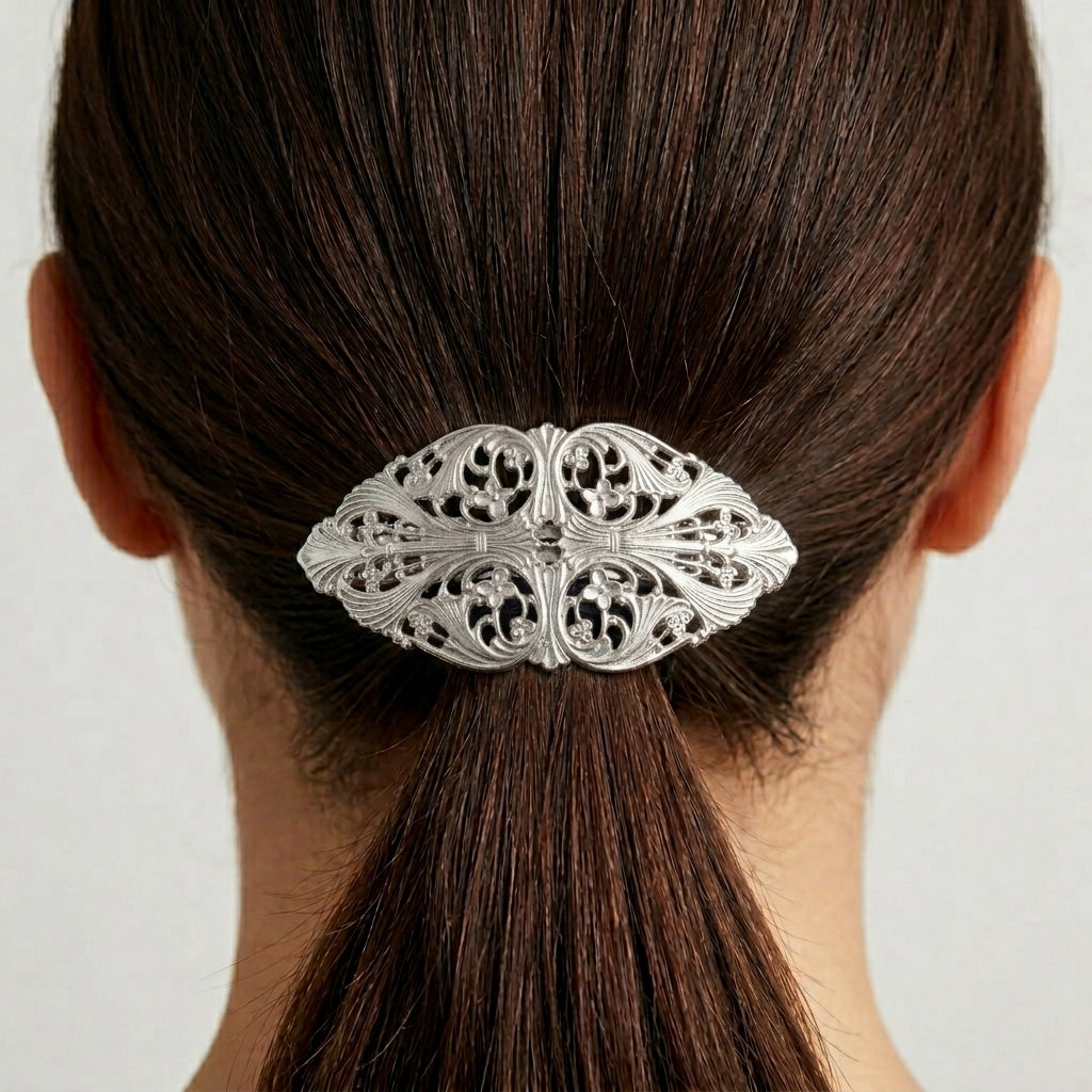 Silver barrette clipped to a woman's ponytail