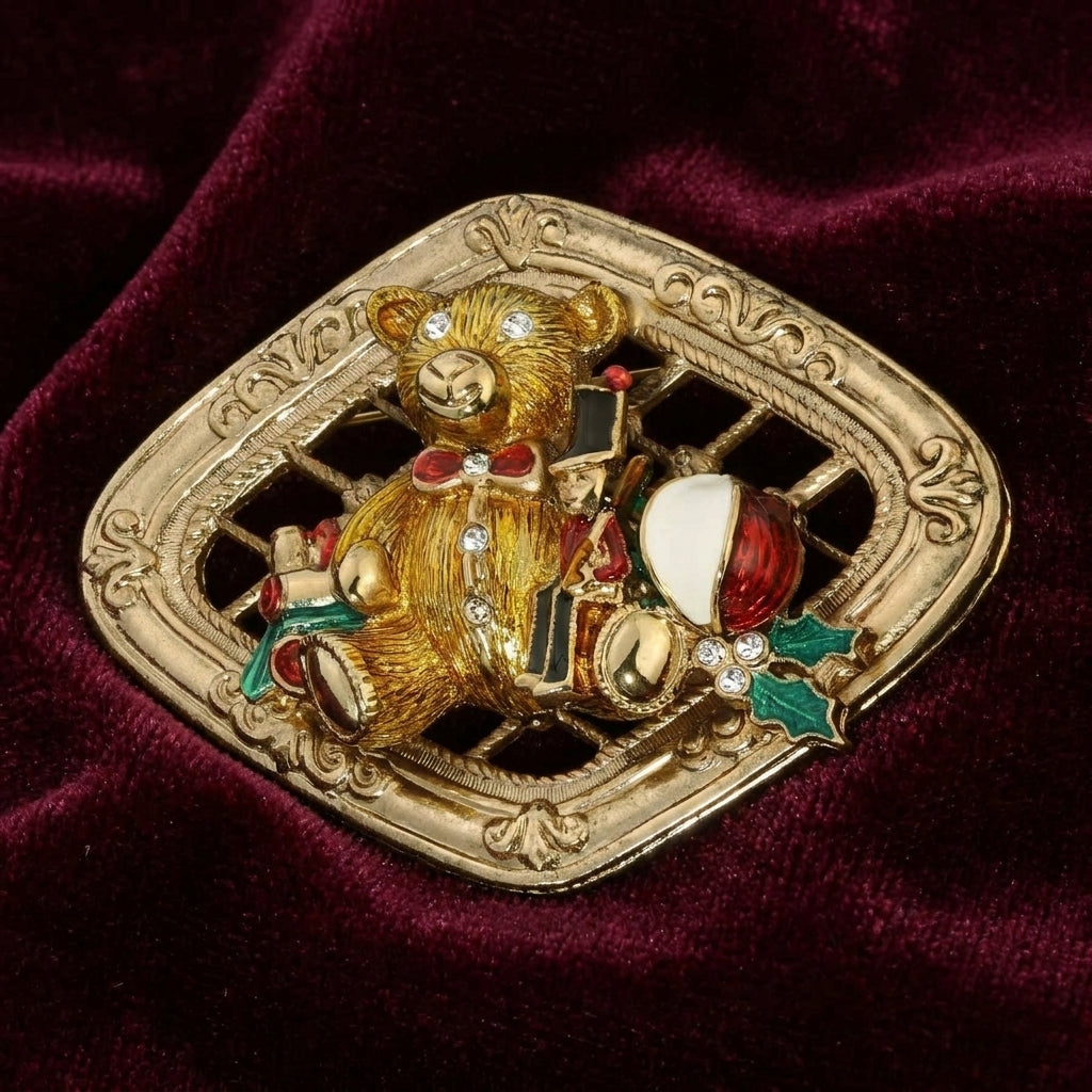 Gold brooch with a teddy bear design on a red velvet background