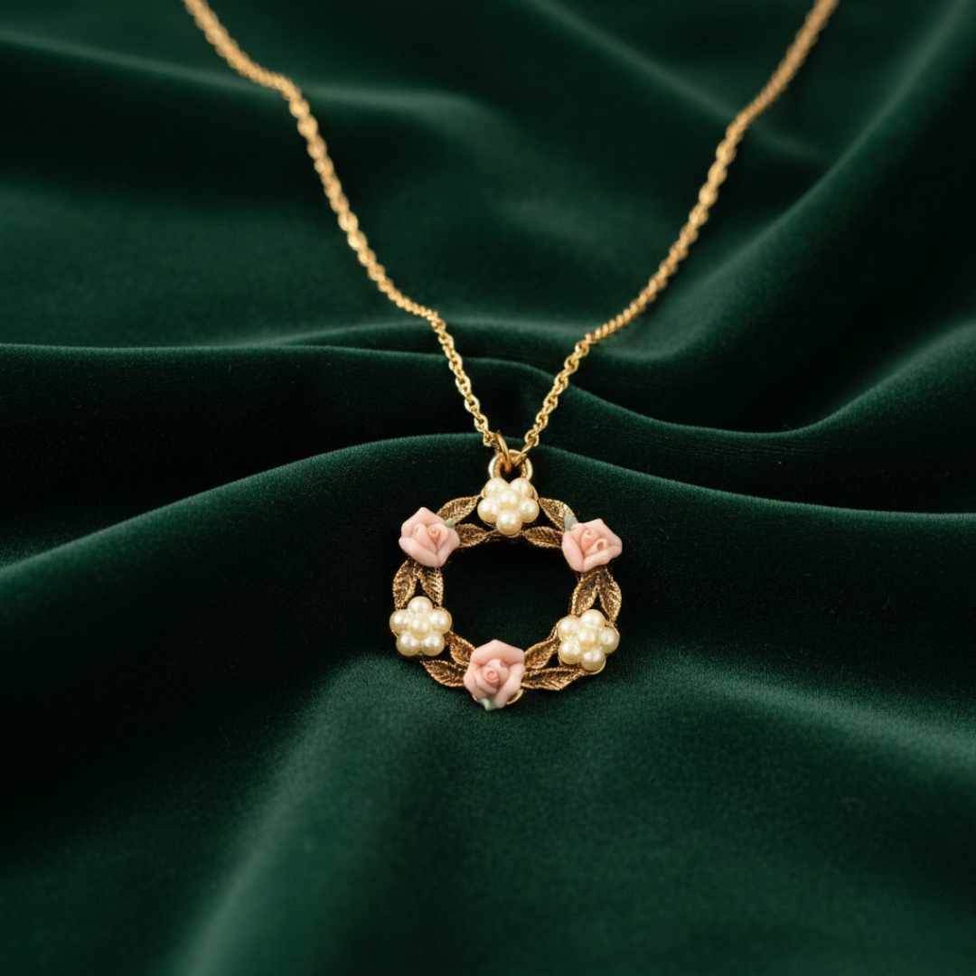 Necklace with a floral pendant on a green fabric background