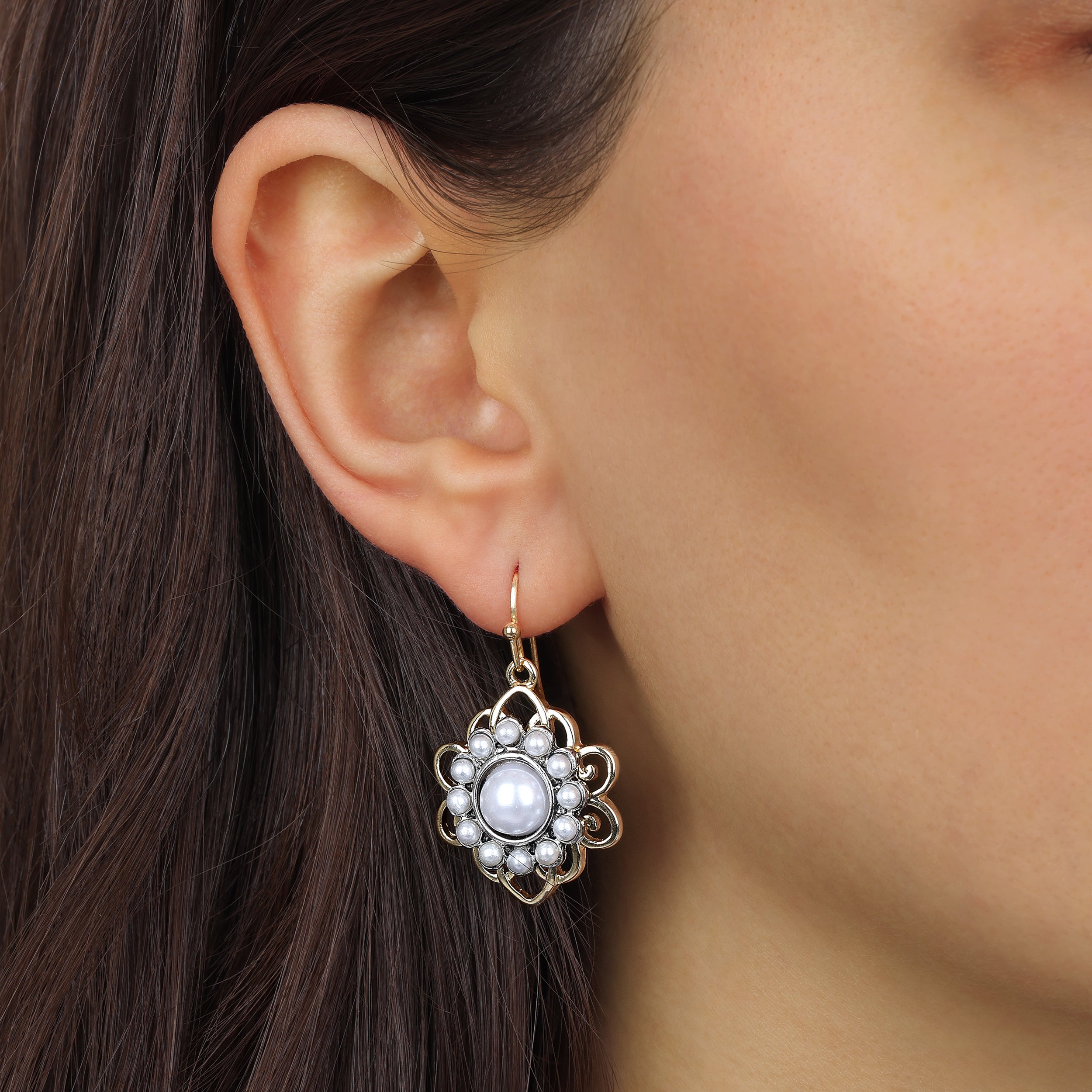 Close up of a model wearing Gold & Silver Tone Filigree Pearl Drop Earrings