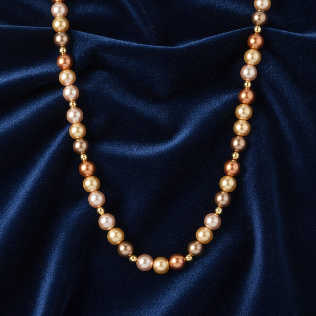 Pearl necklace on a blue satin background