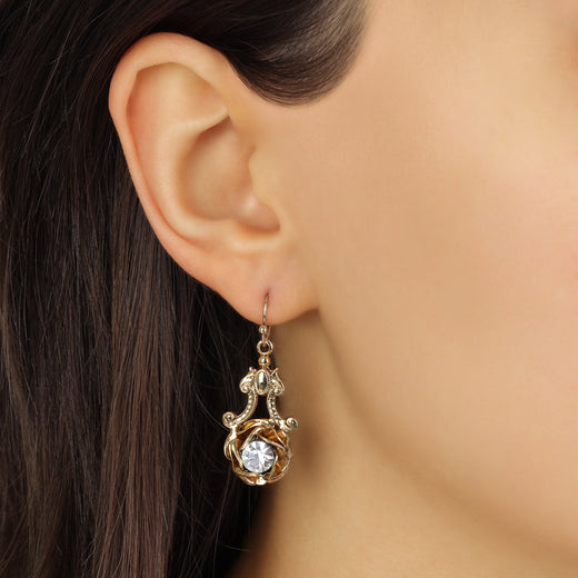 Close up of a model wearing Gold Layered Rose & Crystal Antique Drop Earrings