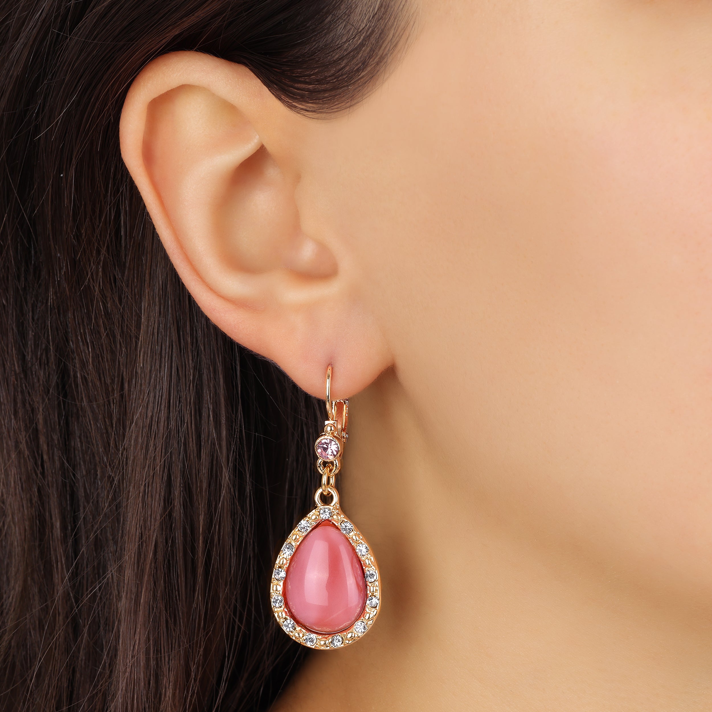Close up of a woman wearing our Gold Tone and Pink Moonstone Euro Crystal Drop Earrings
