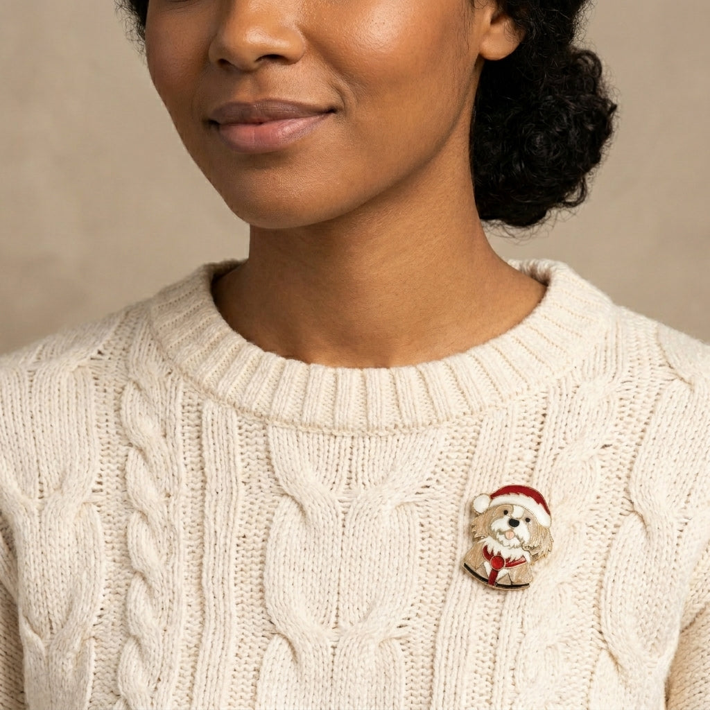 Woman in a white sweater wearing a puppy in a Santa outfit brooch pin