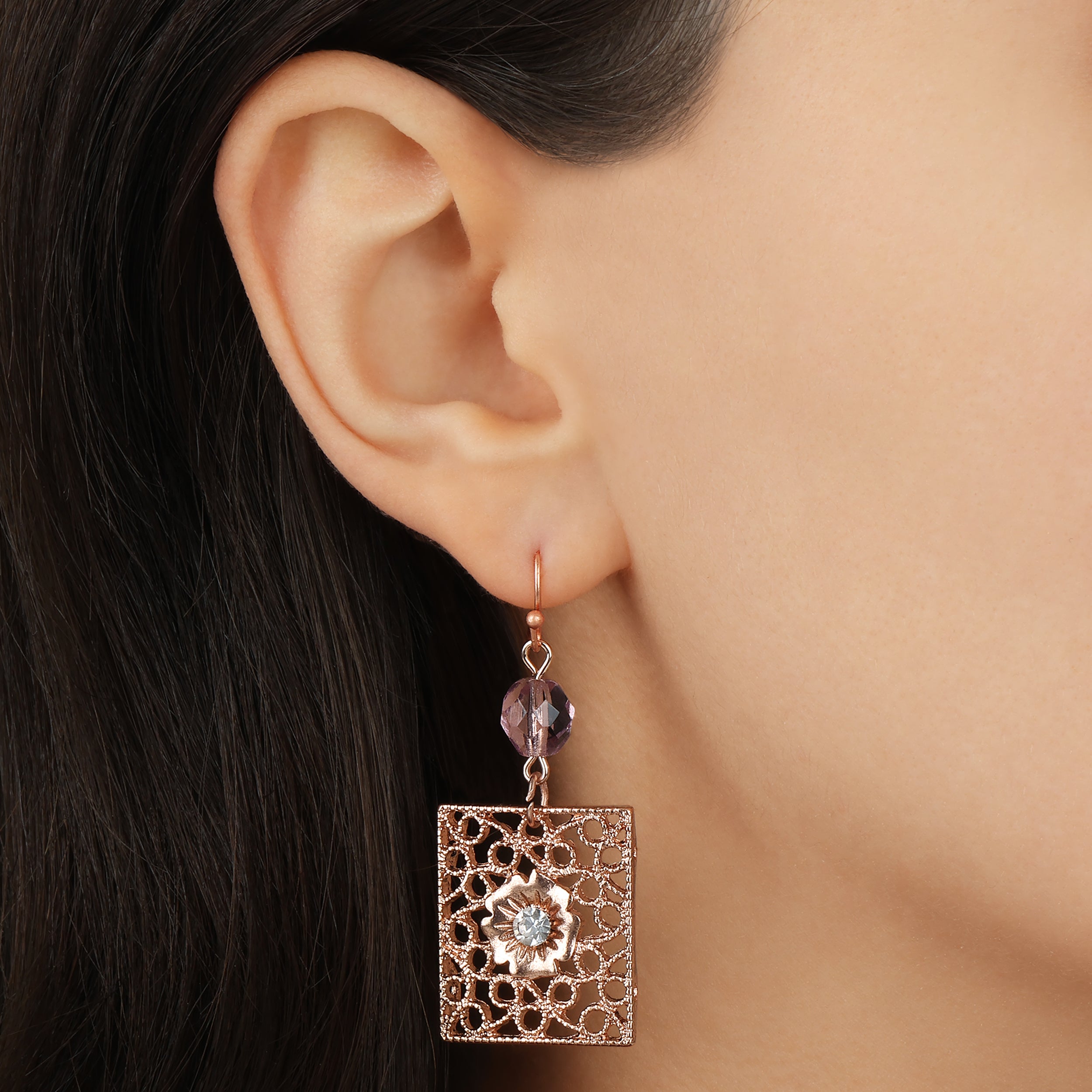 Close up of a model wearing Rose Gold Square Filigree Purple Fire Polished Glass Crystal Drop & Dangle Earrings