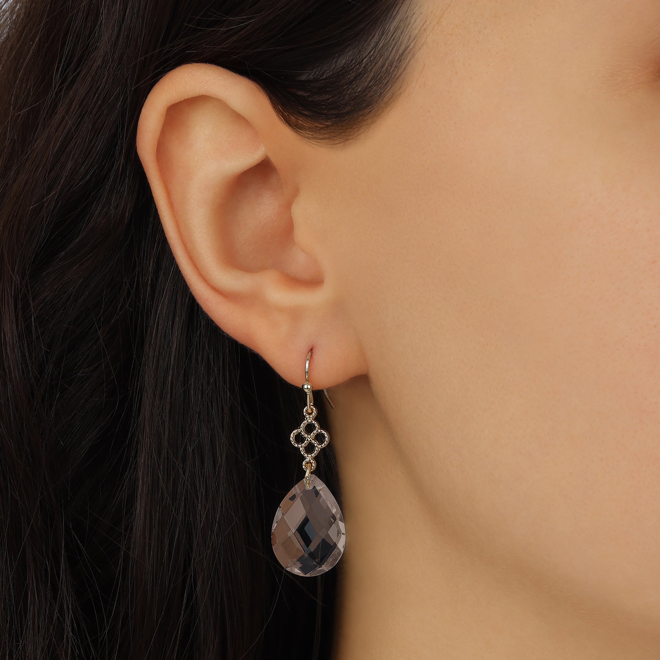 Close up of a woman wearing Faceted Briolette Brown Crystal Teardrop Earrings