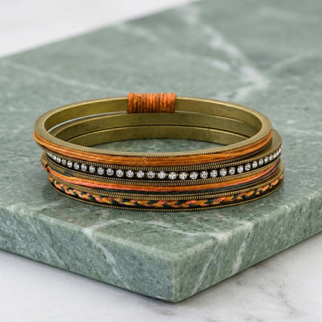 Waxed Linen & Rhinestone Bangle Bracelet resting on light green marble stone