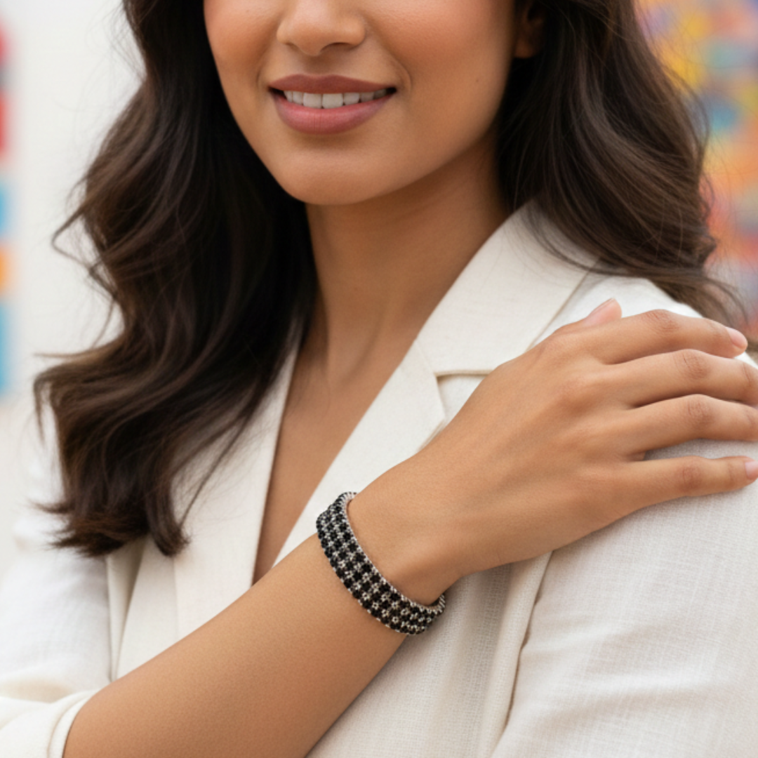 Woman wearing a bracelet with a blurred colorful background