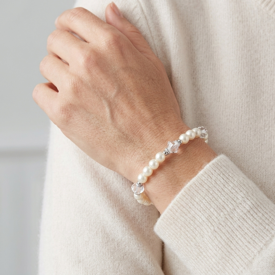 Woman wearing Ivory Faux Pearl And Lantern Crystal Stretch Bracelet