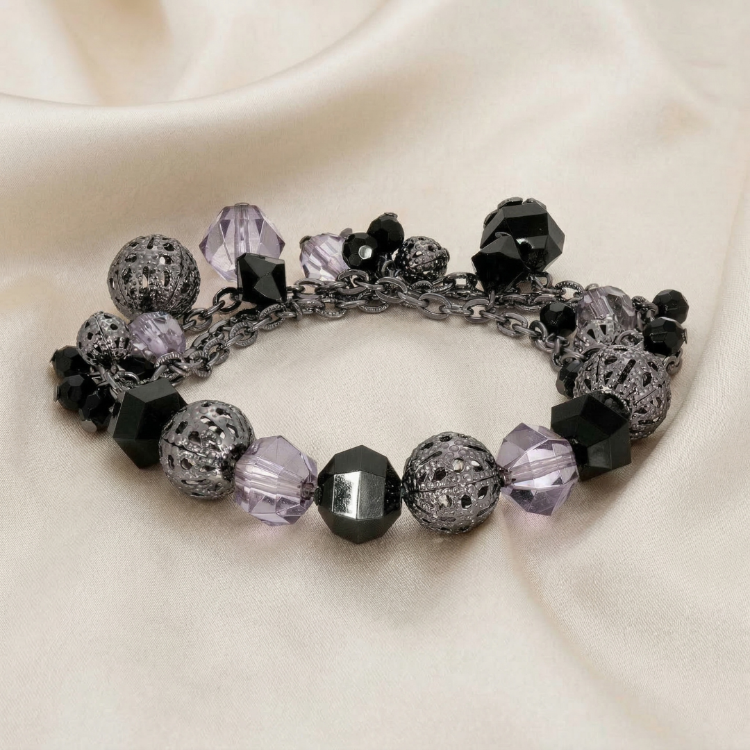 Beaded bracelet with black crystals with Hematite tones on a beige fabric background