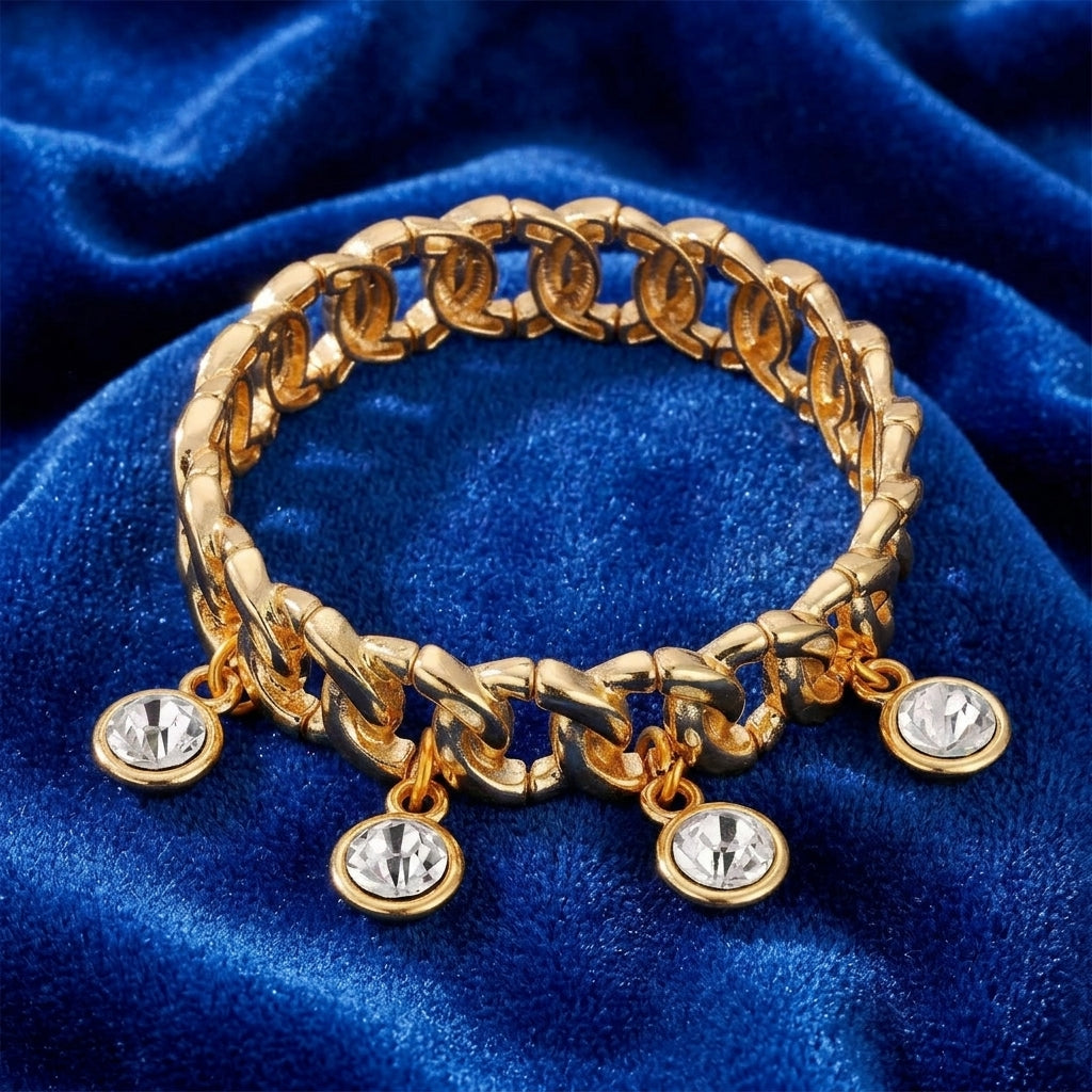 Gold tone Round Multi Crystal Link Stretch Bracelet on a blue velvet background