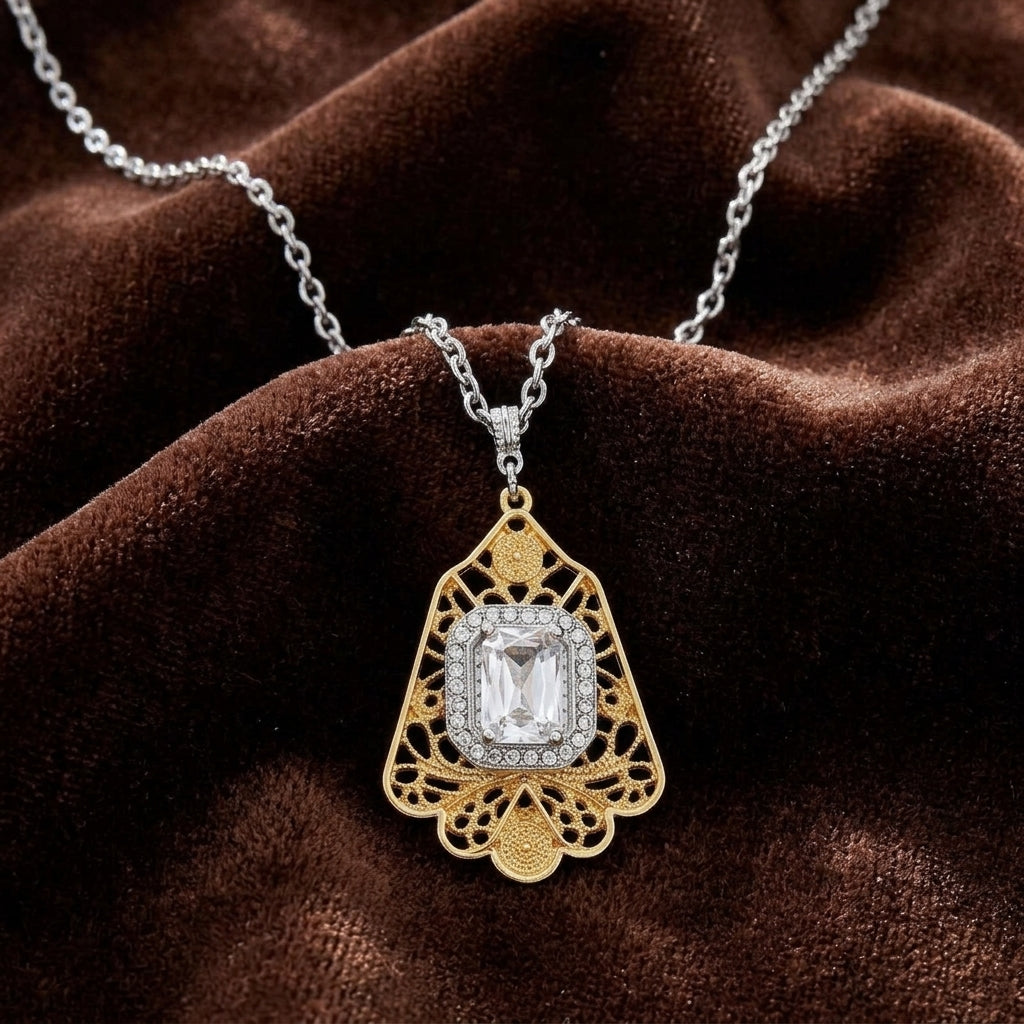 Gold and silver crystal pendant necklace on a brown velvet background