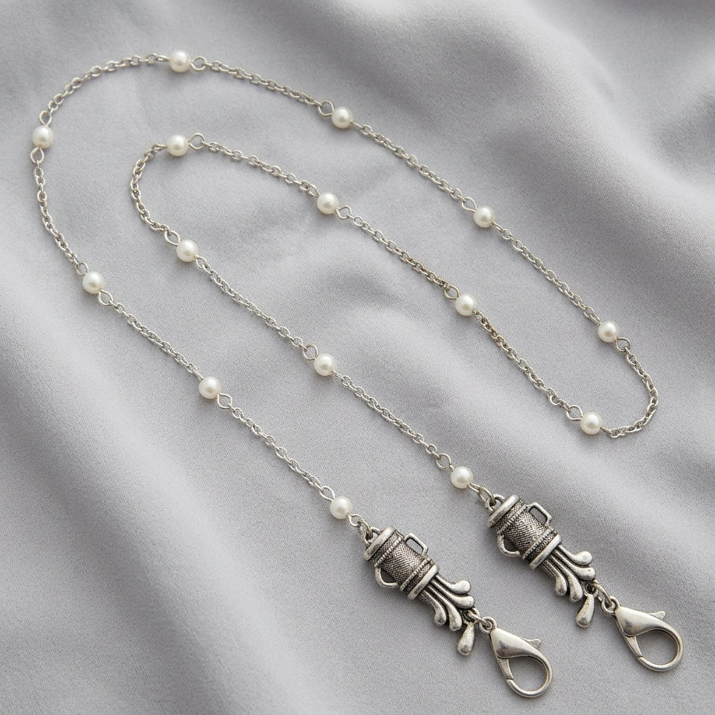 Silver tone Golf Club Set White Faux Pearl Face Mask Chain Holder on light colored fabric