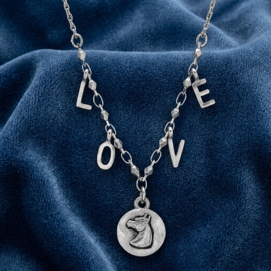 Petite Horse Head Pendant LOVE Initials Necklace on a blue fabric background