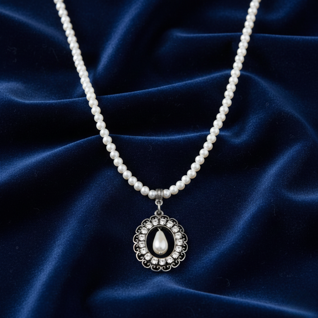 Pearl necklace with a pendant on a blue satin background