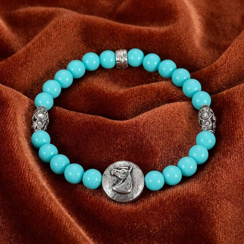 Horse Head Turquoise Beaded Stretch Bracelet on a brown fabric background