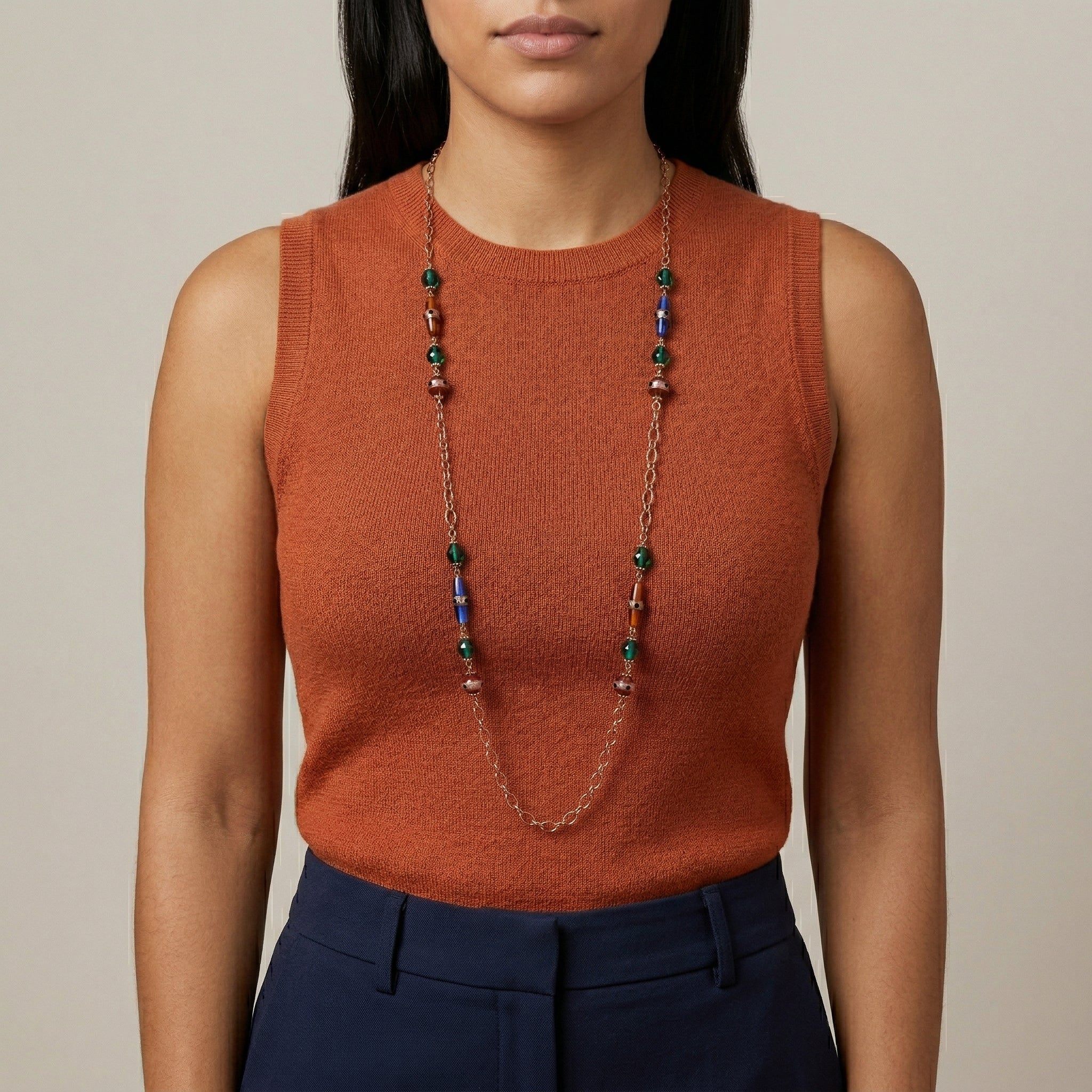 Woman in a dark orange top wearing a Bohemian Multi Color Strandage Necklace