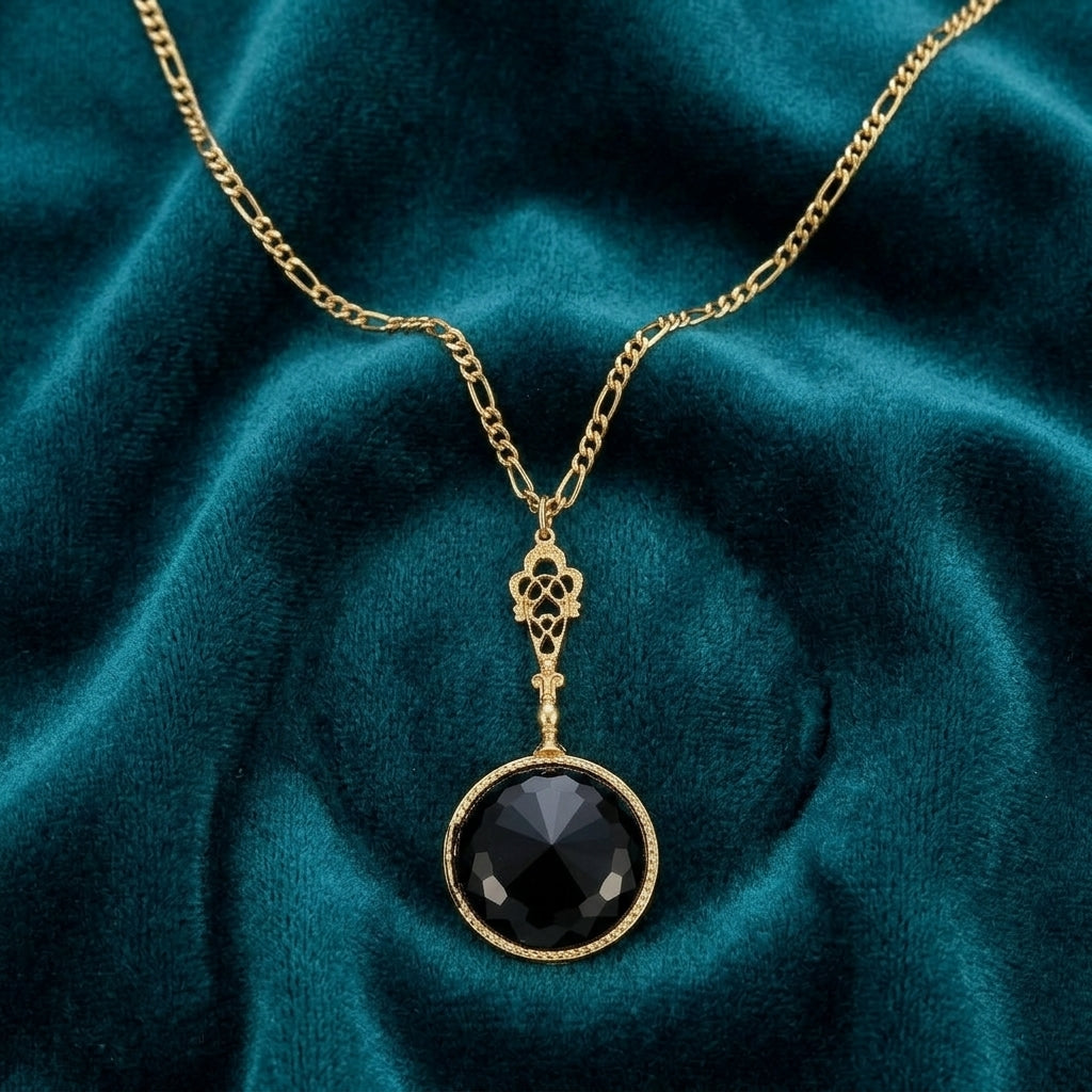 Deco Black Faceted Stone Pendant Necklace on teal fabric