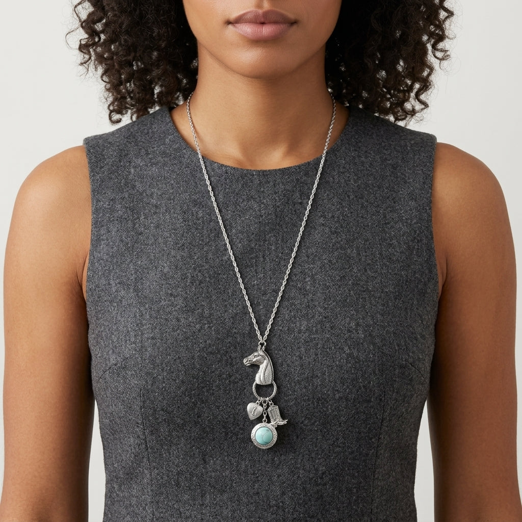 Woman wearing a gray sleeveless top with a Southwest Horse Head Turquoise Locket & Charms Necklace