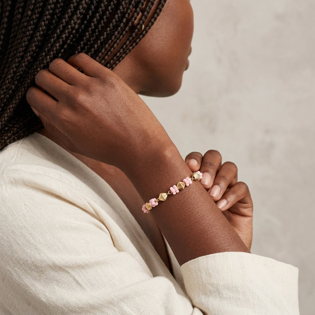 Woman wearing a pink Vintage Flower Power Beaded Bracelet
