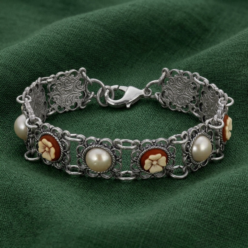 Floral Link Faux Pearl & Ivory Flower Stone Bracelet on a green fabric background