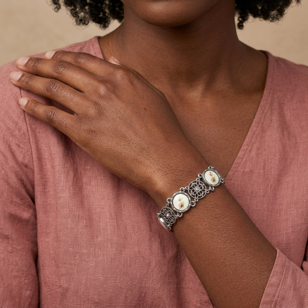 Woman in a pink hote wearing a Meso Round Intricate Filigree Pink & White Stone Link Bracelet