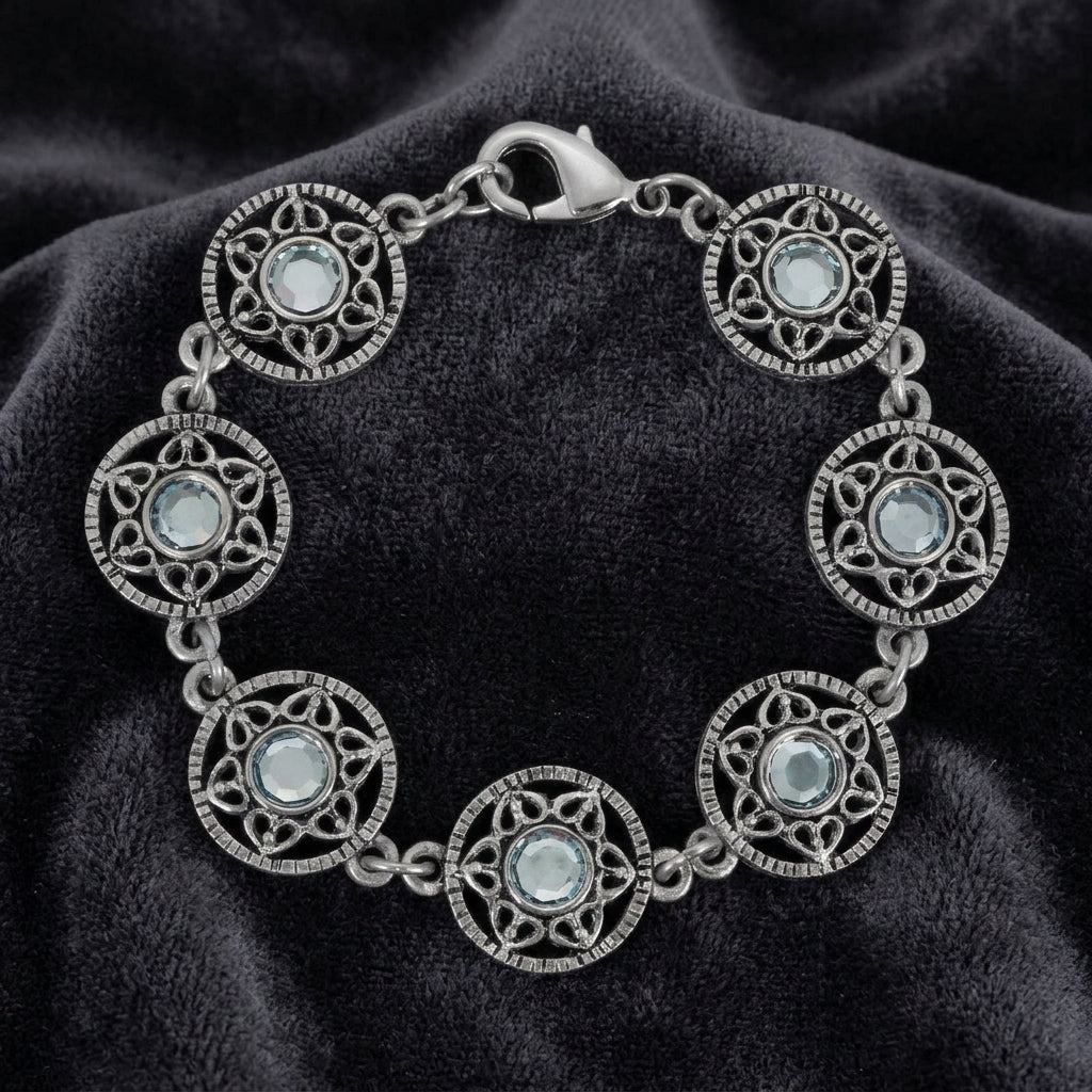 Silver Star Disk Light Sapphire Channel Crystal Link Bracelet on a dark fabric background