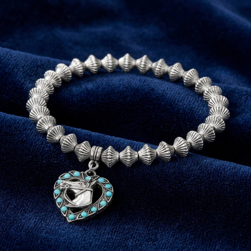 Heart Horse Head Turquoise Crystal Lantern Bead Stretch Bracelet on a blue fabric background