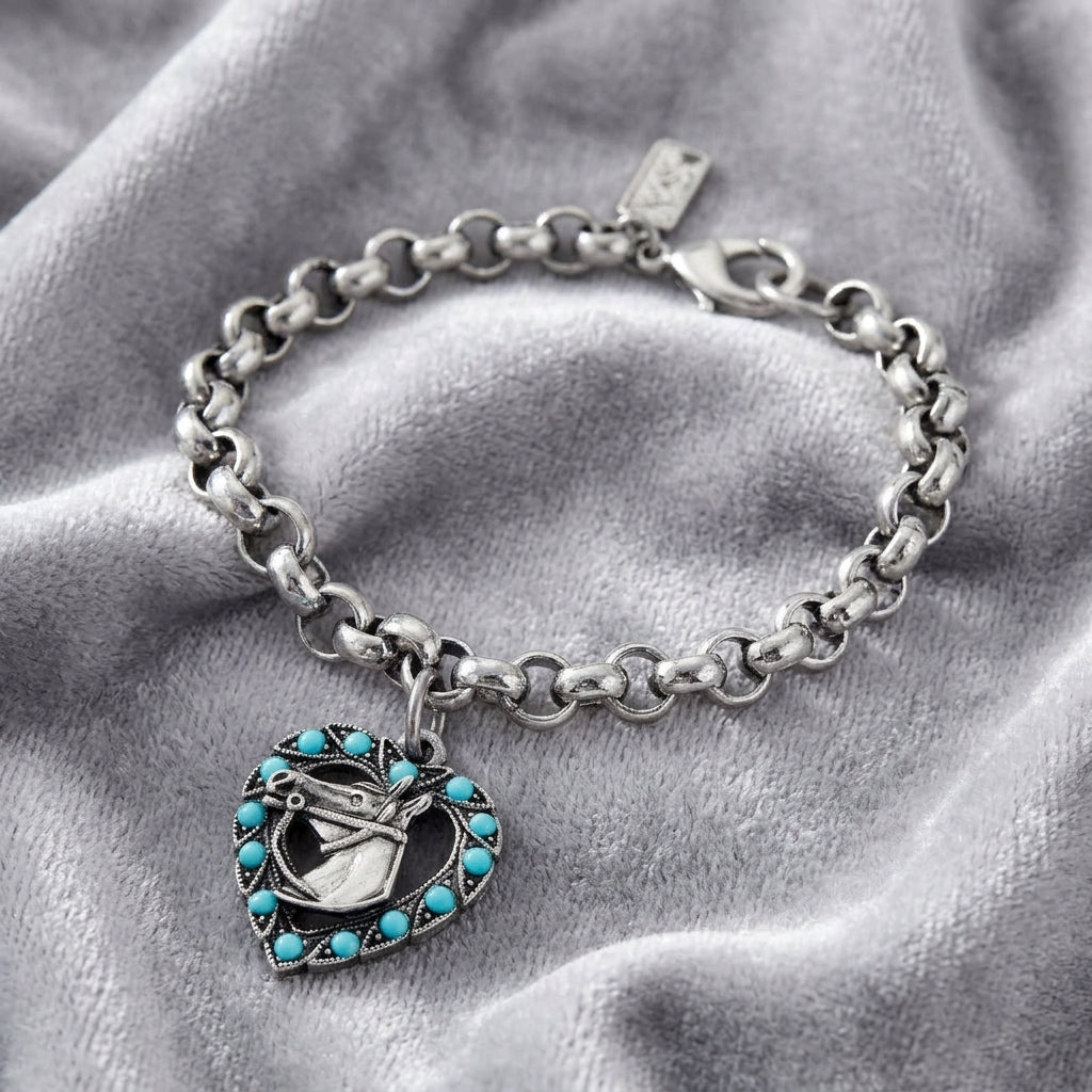 Heart With Horse Turquoise Crystal Round Link Bracelet resting on gray fabric