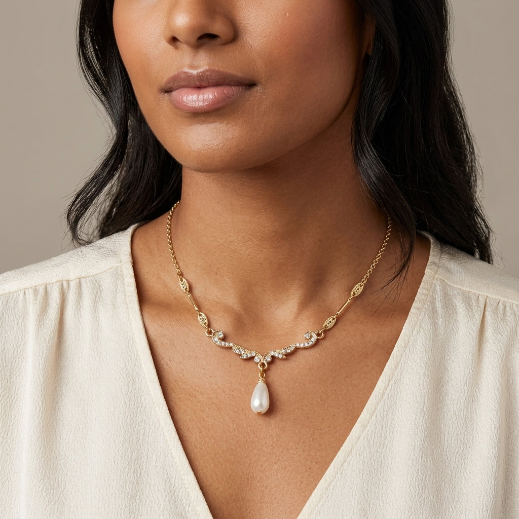 Edwardian Teardrop Faux Pearl Crystal Necklace worn by a woman with a white top