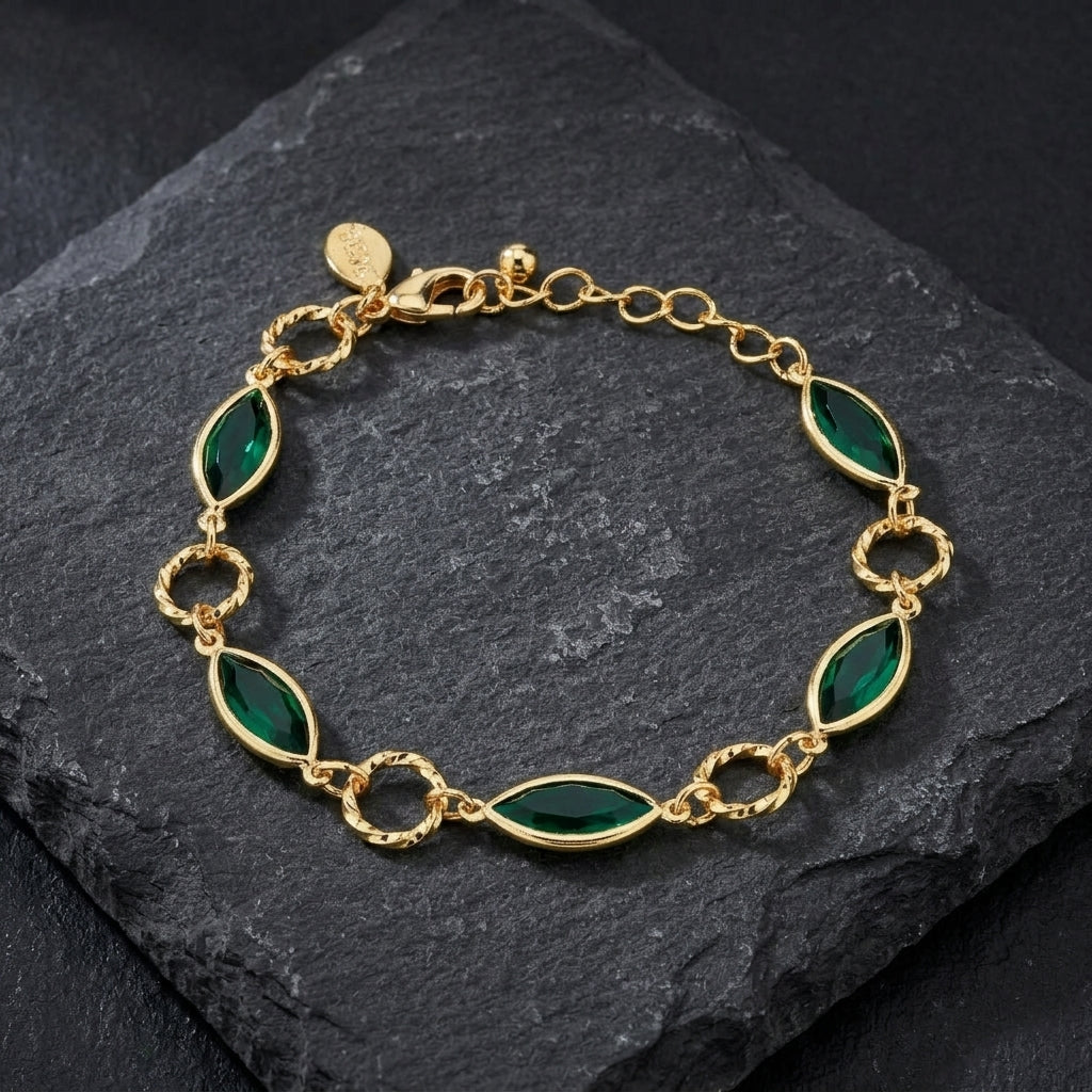 Emerald Green Navette Austrian Crystal Channel Link Bracelet resting on a dark stone surface