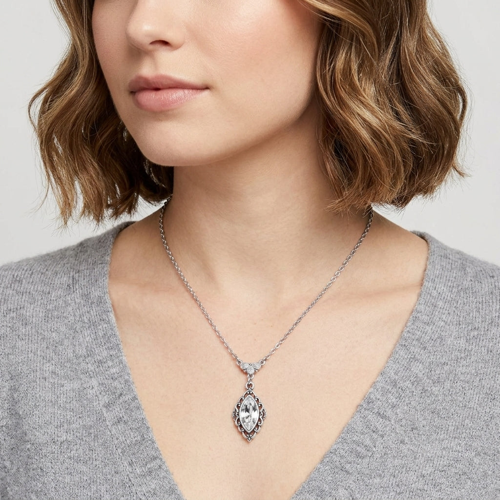 Woman wearing a Navette Crystal Antiqued Drop Necklace