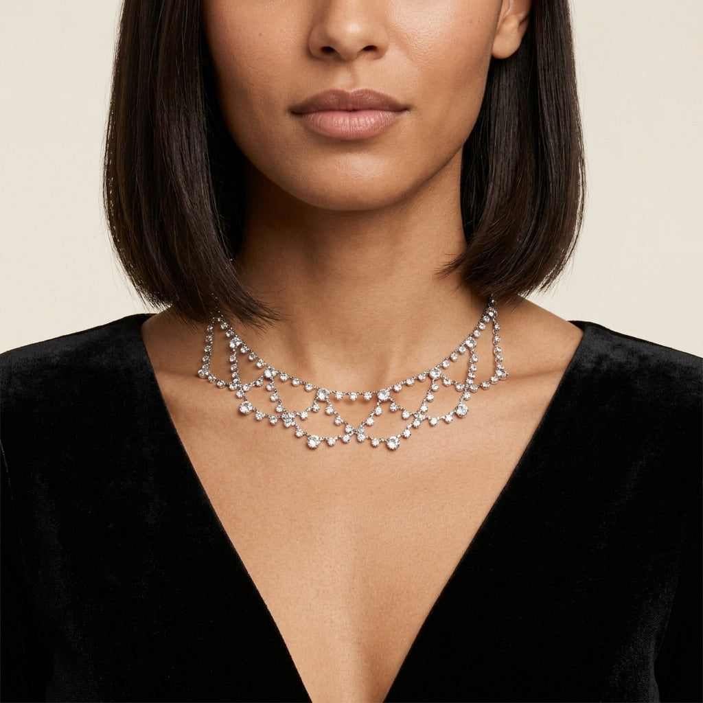 Woman wearing a sparkling Austrian crystal draped necklace against a neutral background