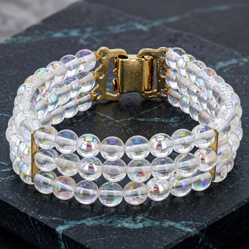 Round Three Row AB Glass Beaded Bracelet resting on dark marble stone surface