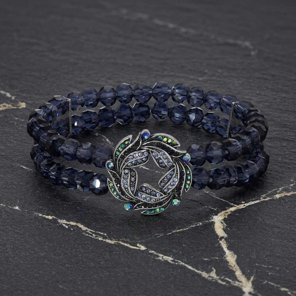 Navy blue double- beaded bracelet with AB crystals on a dark stone surface