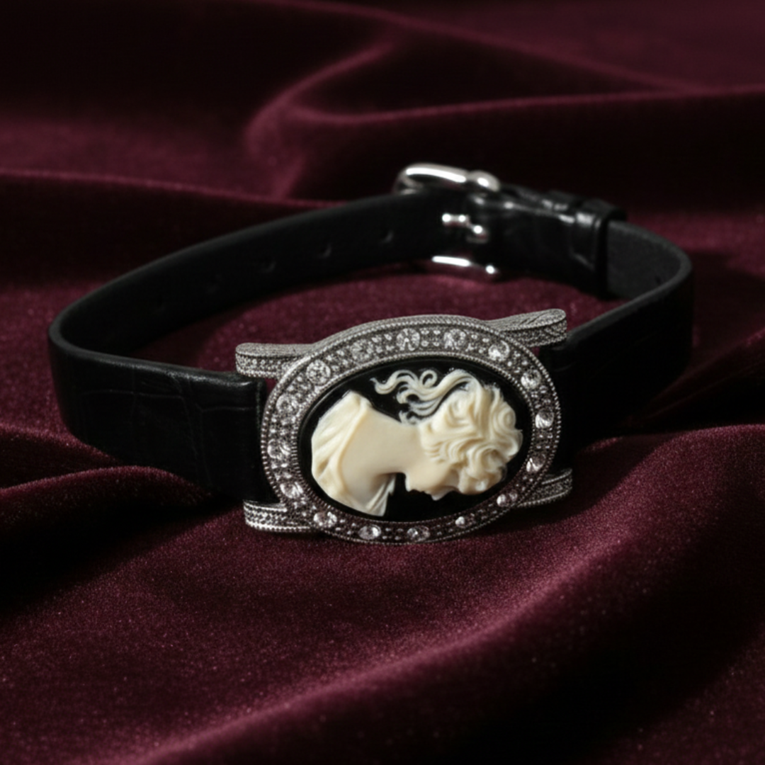 Black leather bracelet with featuring a classical design on a purple fabric background.