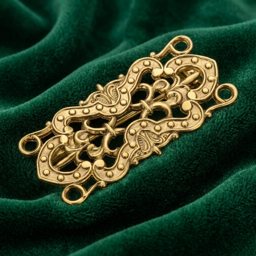 Decorative gold brooch on a green velvet background