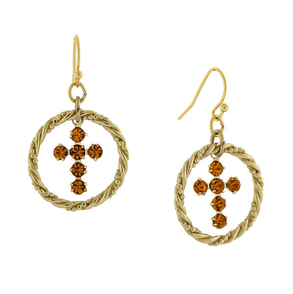 Gold earrings with circular designs and brown gemstones on a white background