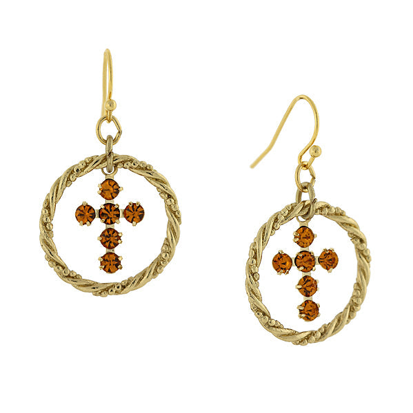 Gold earrings with circular designs and brown gemstones on a white background