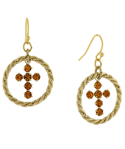 Gold earrings with circular designs and brown gemstones on a white background