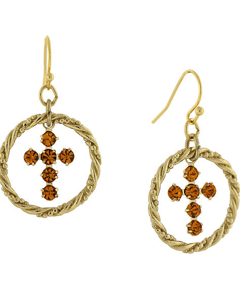 Gold earrings with circular designs and brown gemstones on a white background
