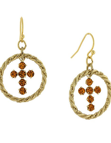 Gold earrings with circular designs and brown gemstones on a white background