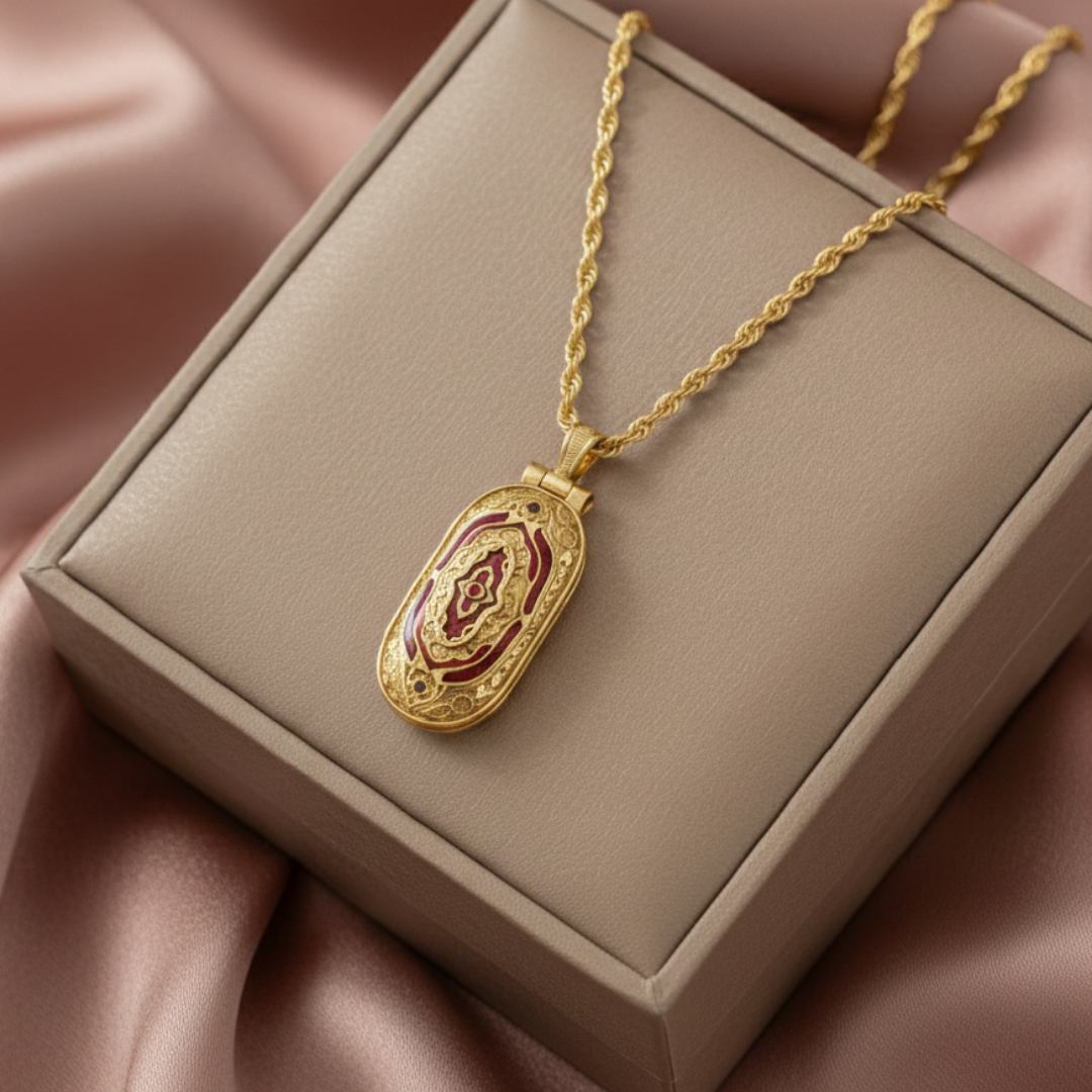 Gold necklace with a pendant on a beige box