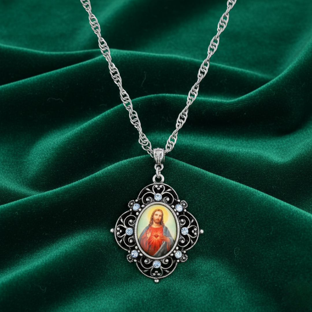 Necklace with a Jesus pendant featuring a religious icon on a green fabric background