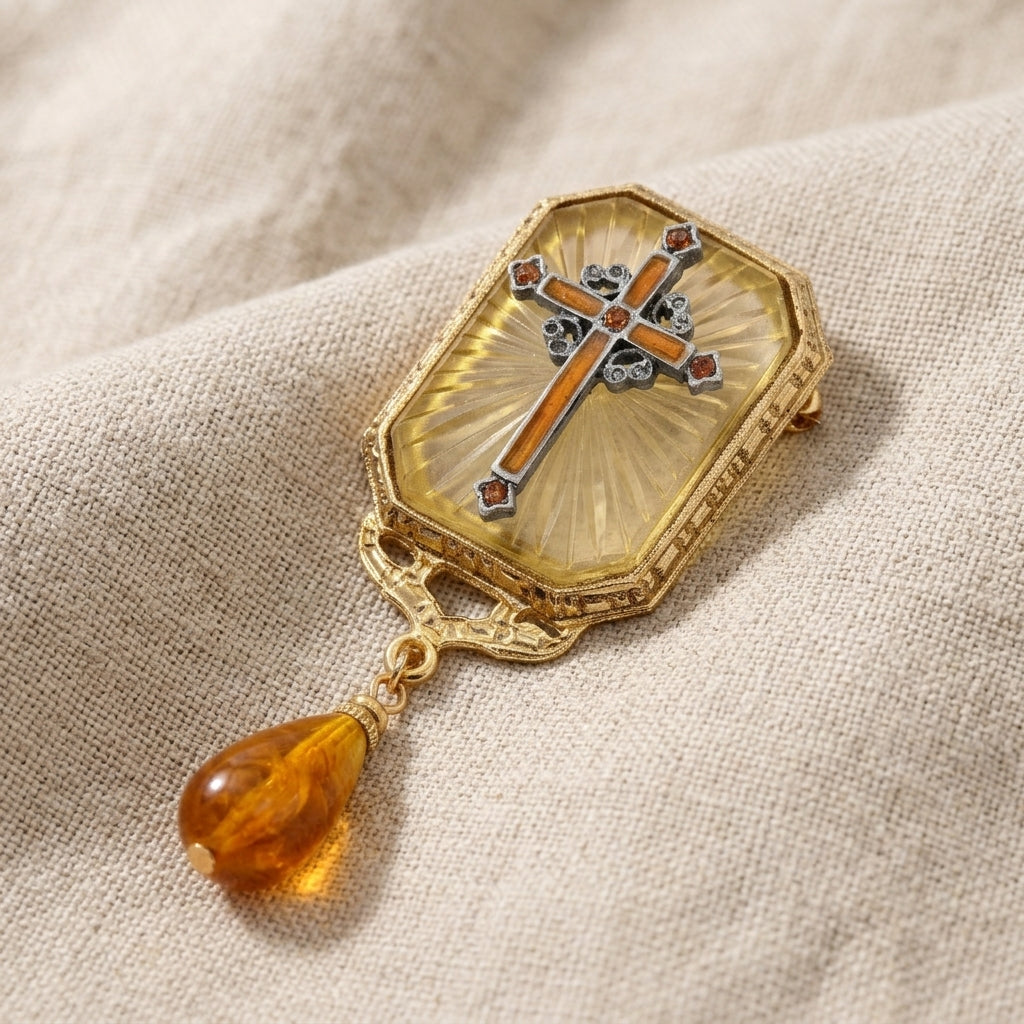 Octagon Frosted Crystal Topaz & Orange Enamel Cross Drop Bead Pin resting on beige linen