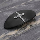 Oval Jet Black Pewter Crystal Cross Hair Barrette on a marble surface