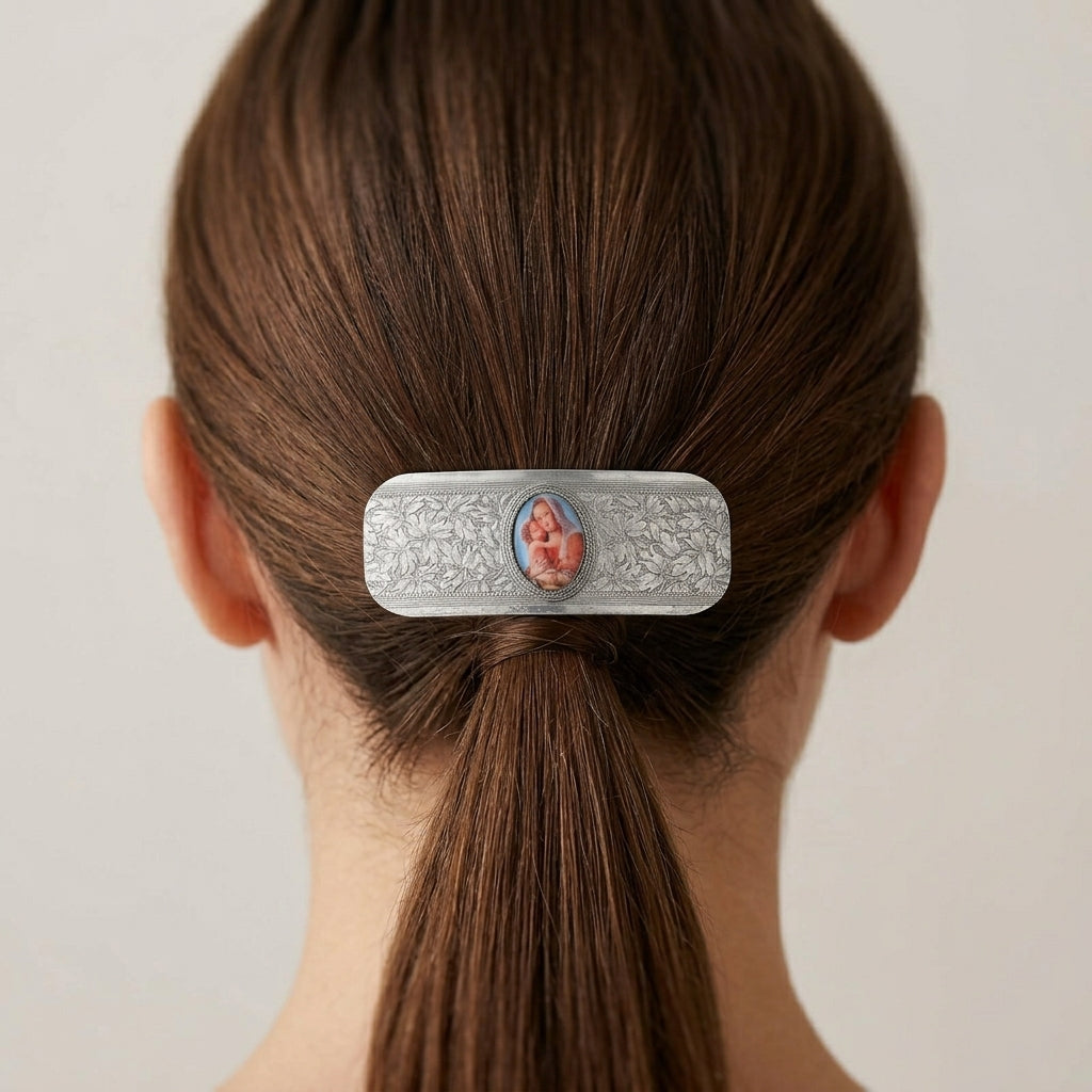 Silver Madonna and Child Floral Hair Barrette in a person's hair against a neutral background