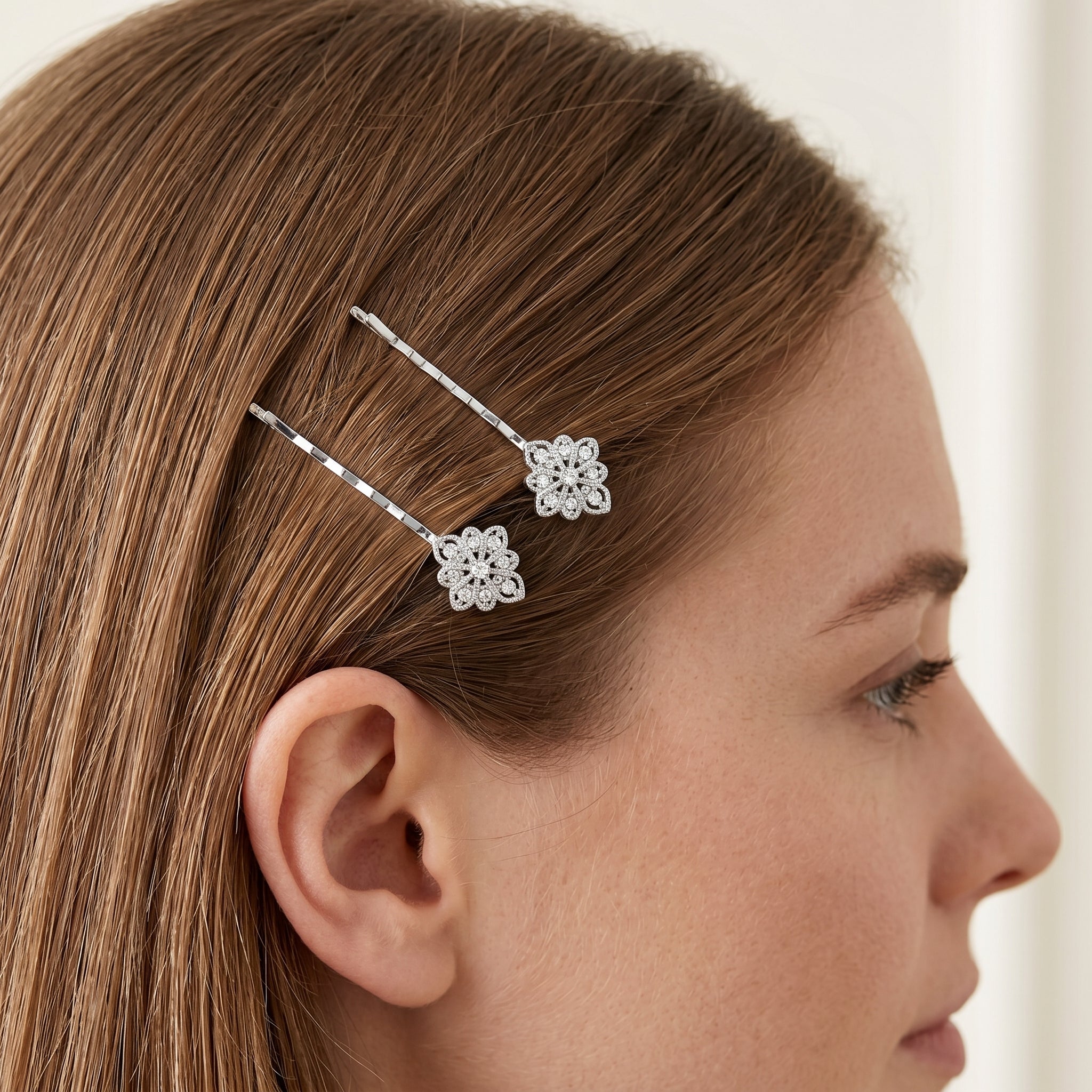 Woman facing sideways wearing a Floral Inspired Crystal Bobby Pin Set