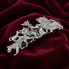 Silver tone Cat Clique Hair Barrette on a red velvet background